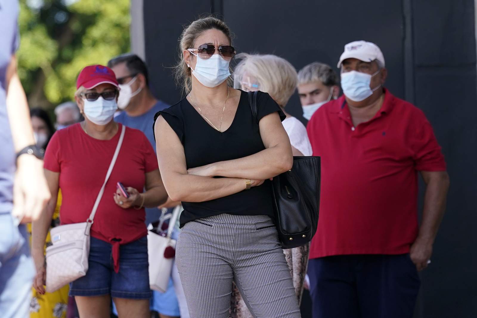 Polling places are latest front in battle over face masks