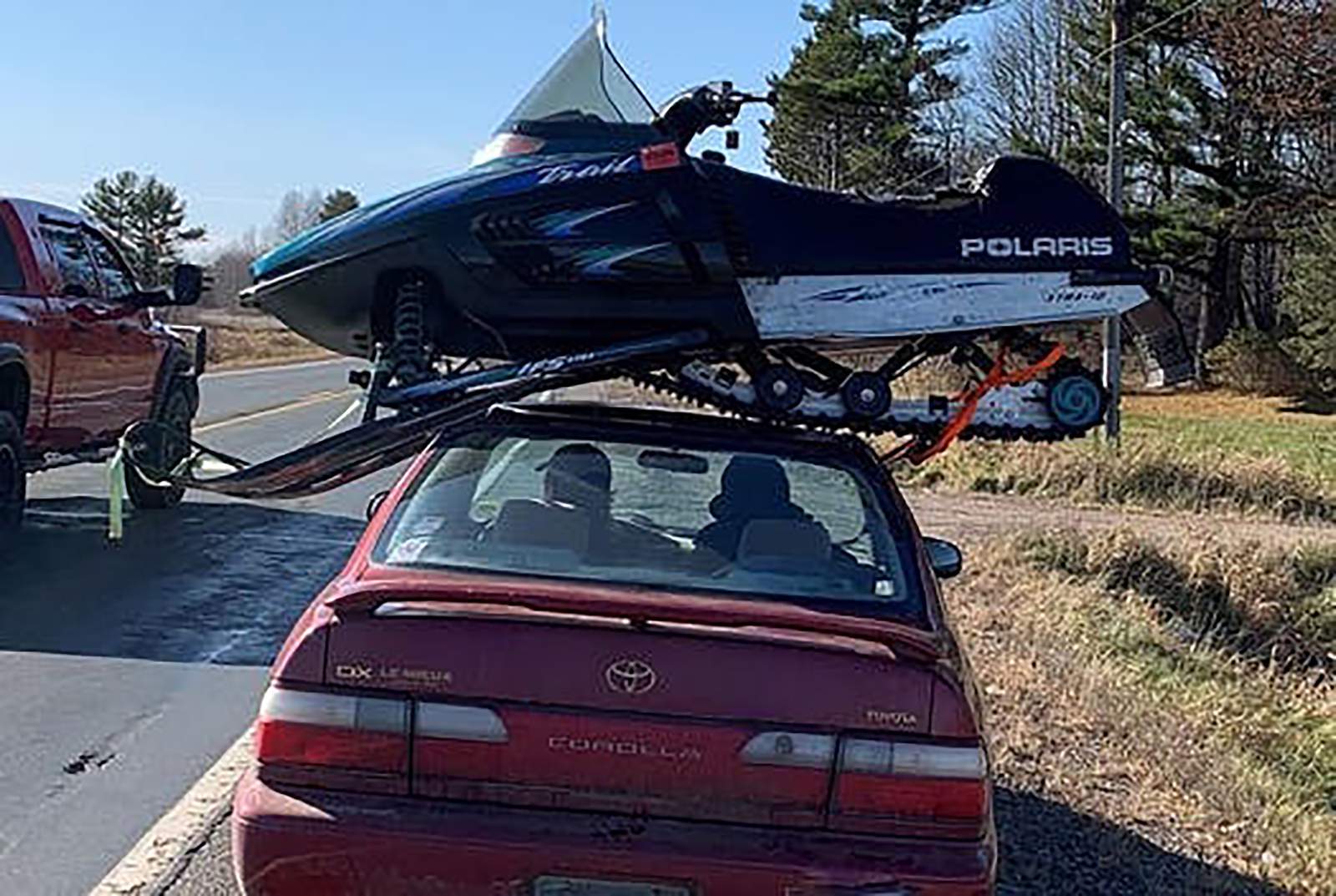 Wisconsin trooper stops driver hauling snowmobile atop car