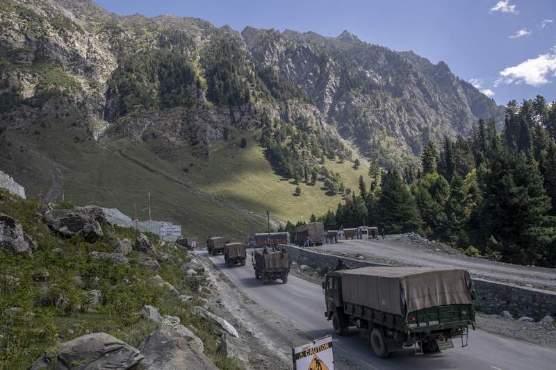 FILE - In this Sept. 9, 2020, record  photo, an Indian service  convoy moves connected  the Srinagar- Ladakh road  astatine  Gagangeer, northeast of Srinagar, Indian-controlled Kashmir. Indian and Chinese service  commanders met Sunday, Oct. 10, 2021 and discussed steps to disengage troops from cardinal  friction areas on  their disputed borderline  to easiness  a 17-month standoff that has sometimes led to deadly clashes, an Indian service  spokesperson  said. (AP Photo/ Dar Yasin, File)