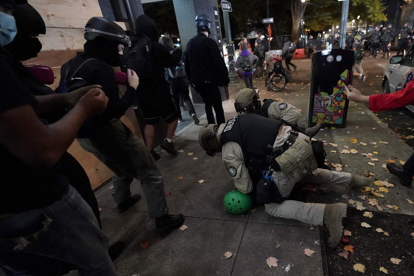 Riot declared in Portland as protesters smash windows