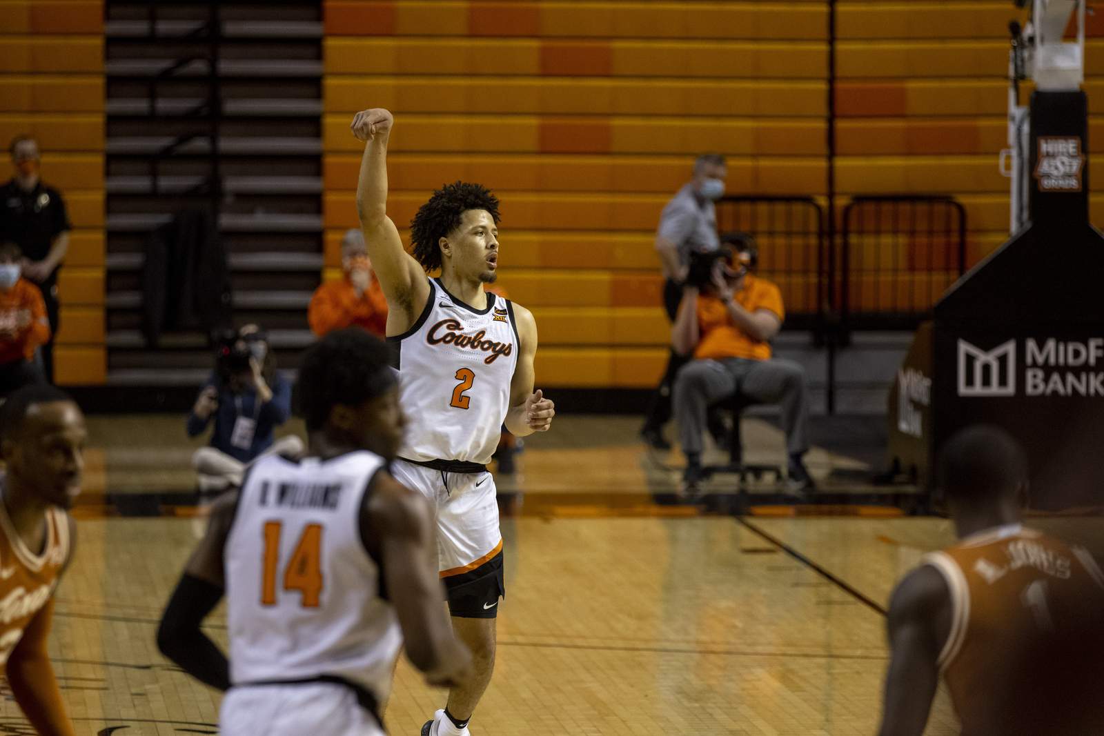 Cunningham helps Oklahoma St beat Texas in double OT
