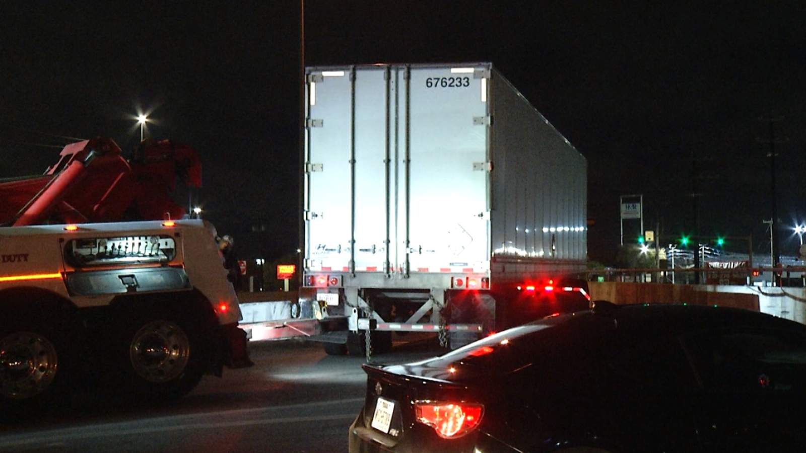 Driver of 18-wheeler fails to navigate turn, damages bridge, police say