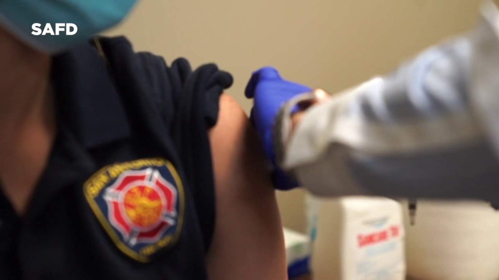 San Antonio Fire Department EMS personnel roll up their sleeves for COVID-19 vaccine