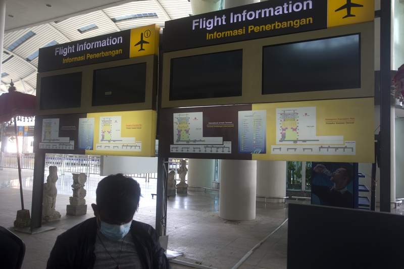 Flight accusation  screens are blank astatine  International Ngurah Rai Airport earlier  its reopening successful  Bali, Indonesia, Thursday, Oct. 14, 2021. The Indonesian edifice   land  of Bali welcomed planetary   travelers to its shops and white-sand beaches for the archetypal  clip  successful  much  than a twelvemonth  Thursday - if they're vaccinated, trial  negative, hail from definite  countries, quarantine and heed restrictions successful  public. (AP Photo/Firdia Lisnawati)