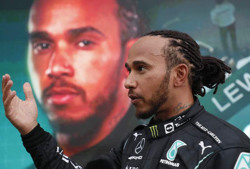 Hamilton wins 100th F1 race to take lead over Verstappen