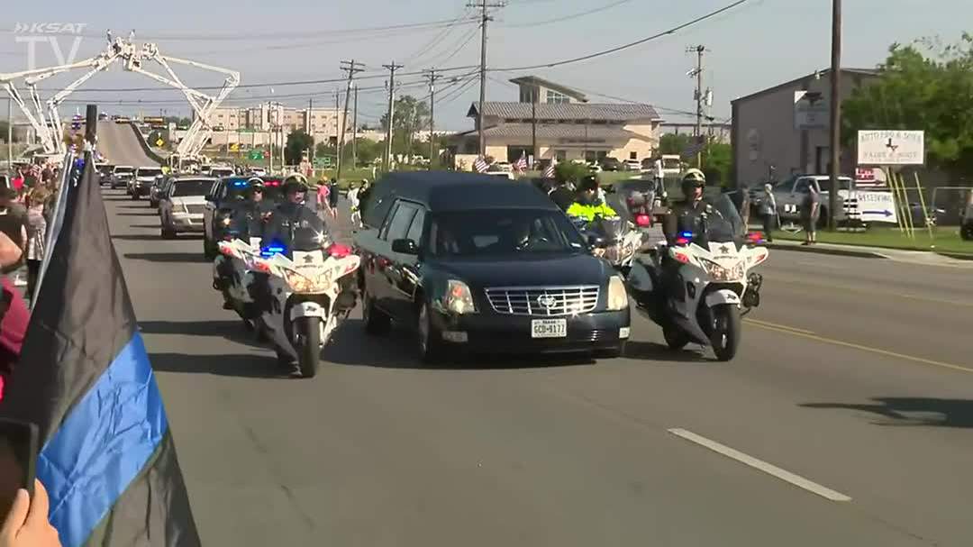 WATCH: San Marcos community salutes slain officer as procession passes through town