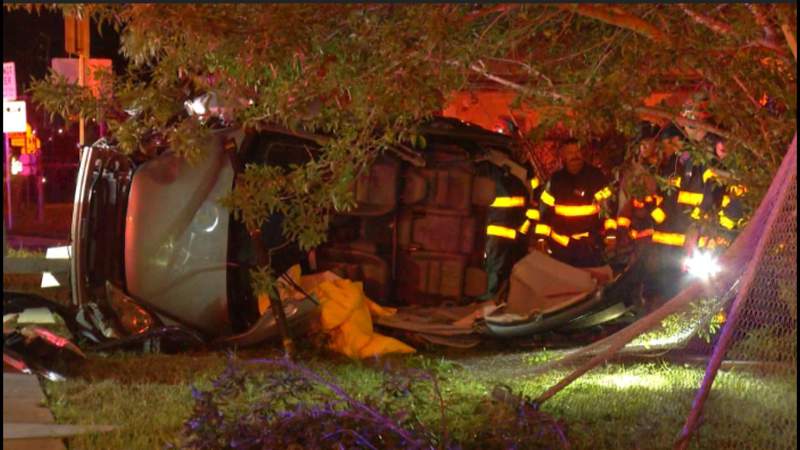 SAPD: Woman extracted from SUV after rollover crash into bus stop, fence