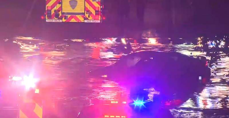 Mother, four kids rescued after vehicle gets stuck on flooded roadway, officials say