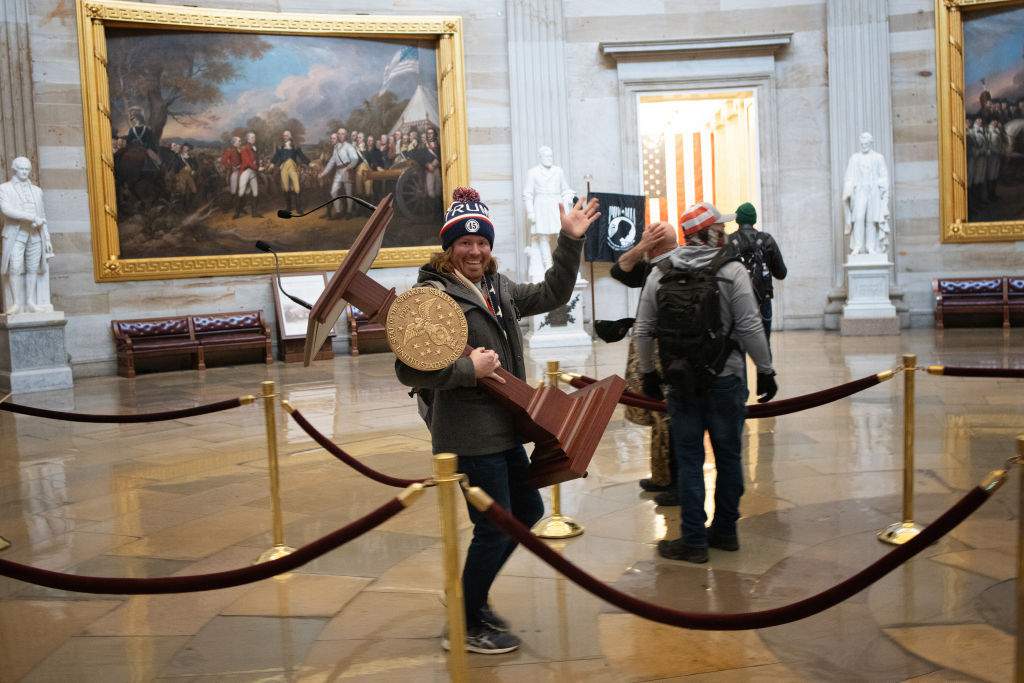 Report: Man seen carrying Pelosi’s lectern in viral photo during Capitol riot arrested