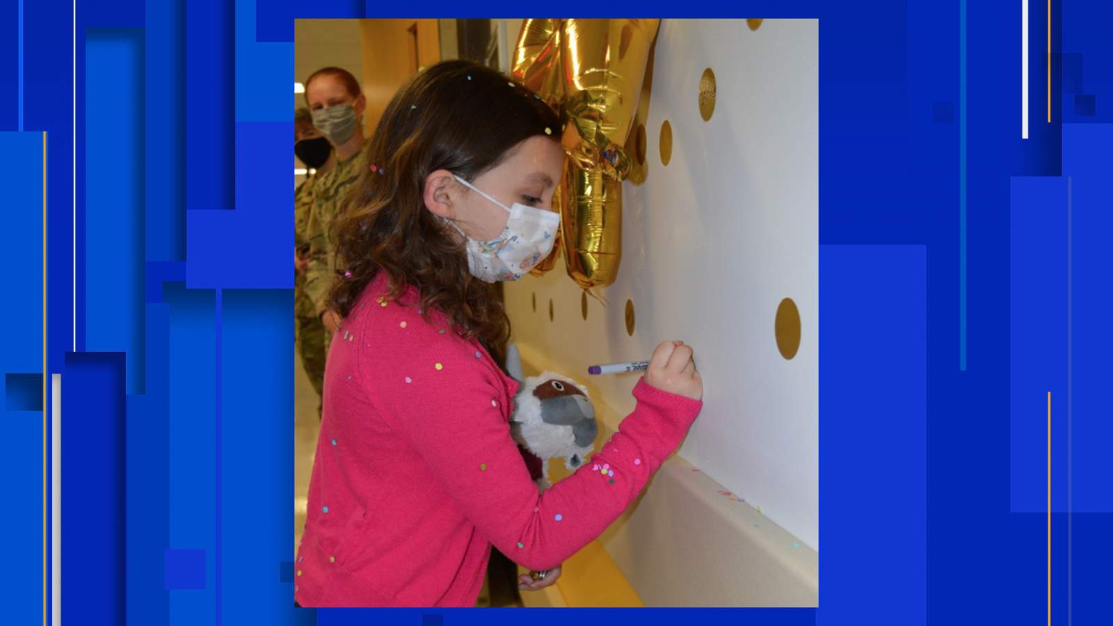 Young cancer survivor rings bell at BAMC to celebrate final treatment