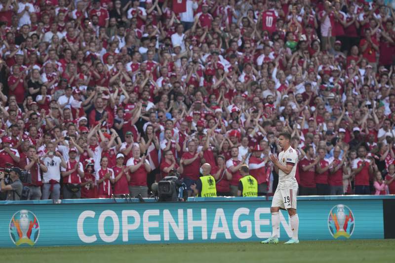 Play halted for Eriksen tribute during Denmark-Belgium game