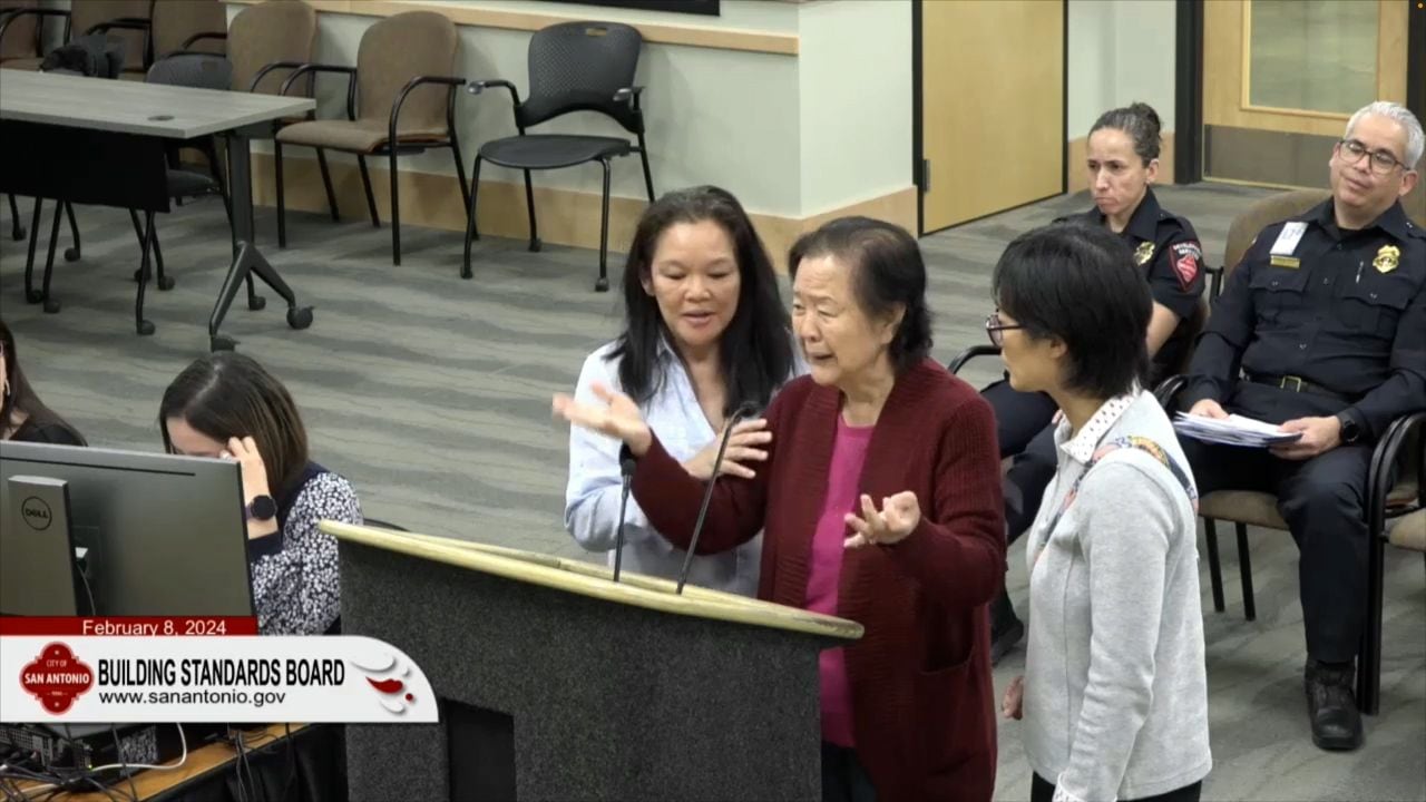 An emotional Ann Louie addresses the Building Standards Board Feb. 8.