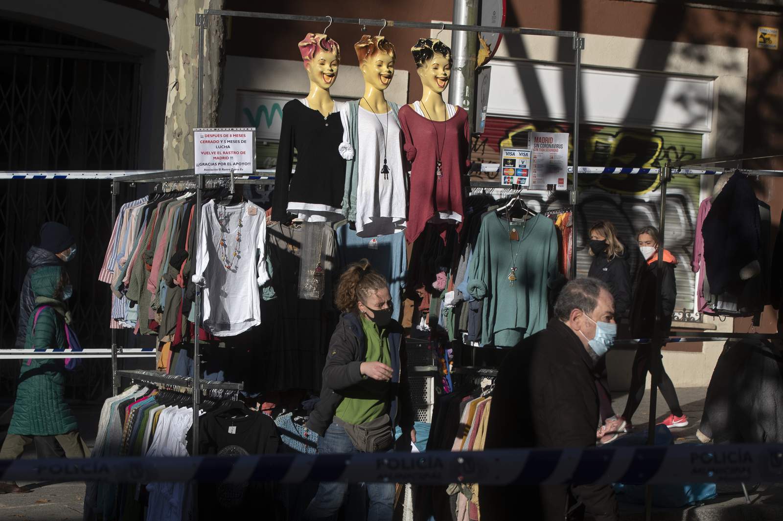 Ancient Madrid market reopens amid debate over virus rules