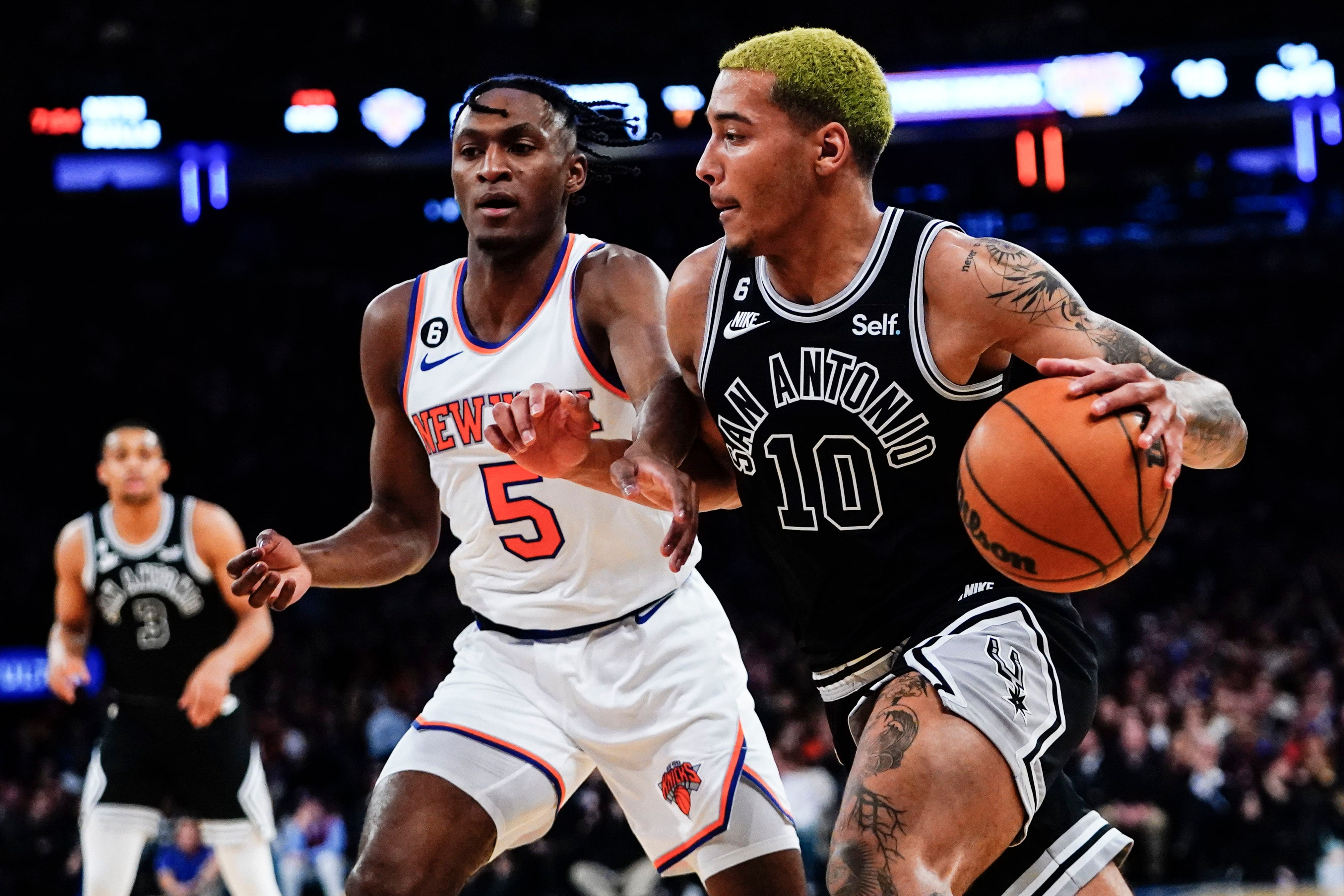 San Antonio Spurs' Jeremy Sochan (10) drives past New York Knicks' Immanuel Quickley (5) during the first half of an NBA basketball game Wednesday, Jan. 4, 2023, in New York. (AP Photo/Frank Franklin II)