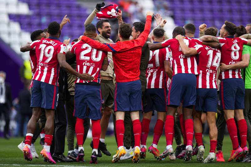 Atlético holds on to win 1st Spanish league title since 2014