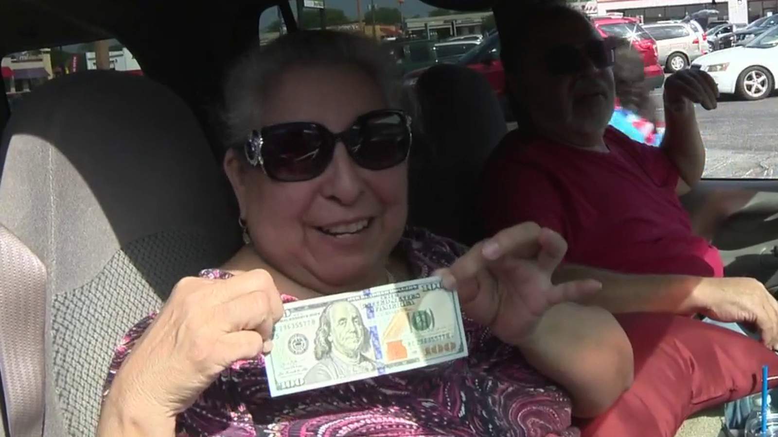 Seniors surprised with $100 during food giveaway