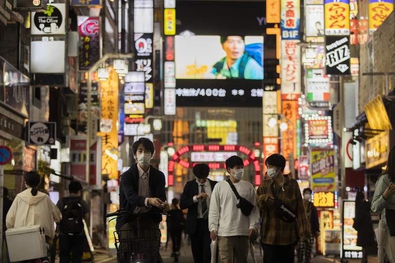 Vaccines, masks? Japan puzzling over sudden virus success