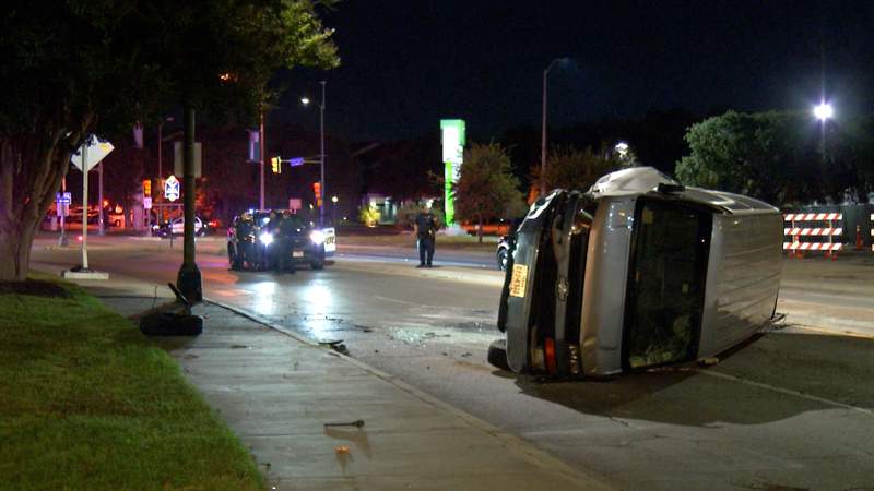 Man detained on suspicion of DWI after rollover crash near downtown, police say