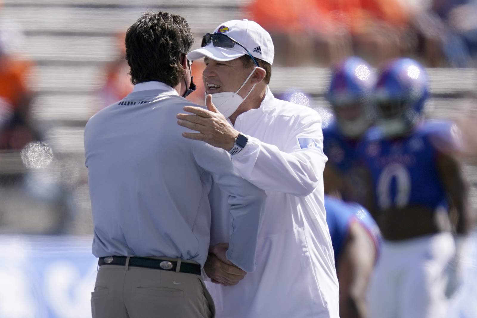 Kansas coach cleared of virus but skips West Virginia game