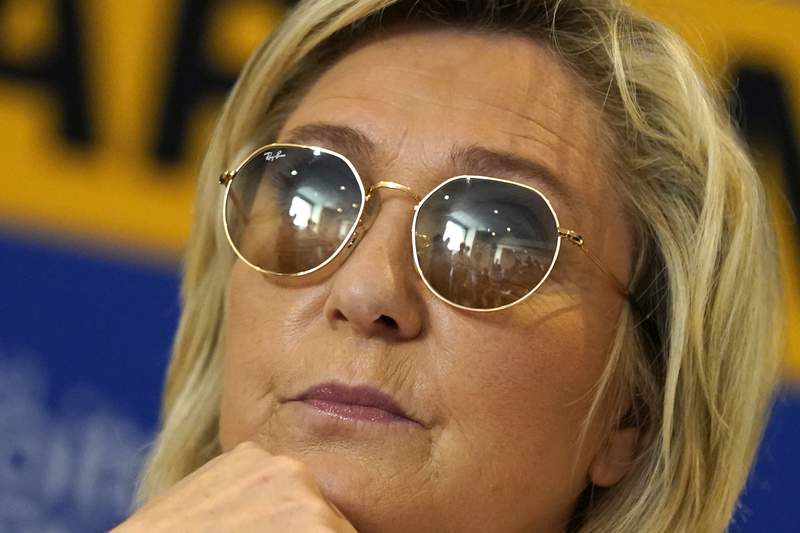 French far-right chief criticized for her mainstream turn