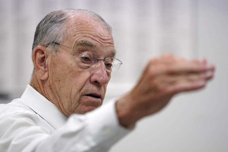 Eyeing another run, Grassley shows Iowans he's keeping up