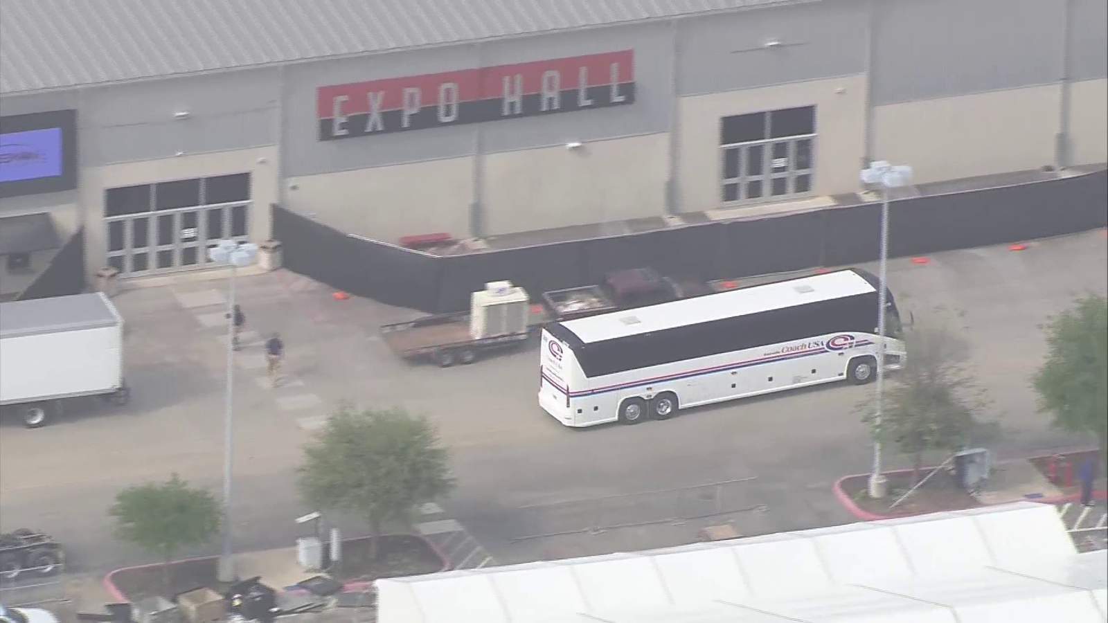 WATCH: Buses transporting migrant children from Rio Grande Valley arrive at Freeman Coliseum Expo Halls