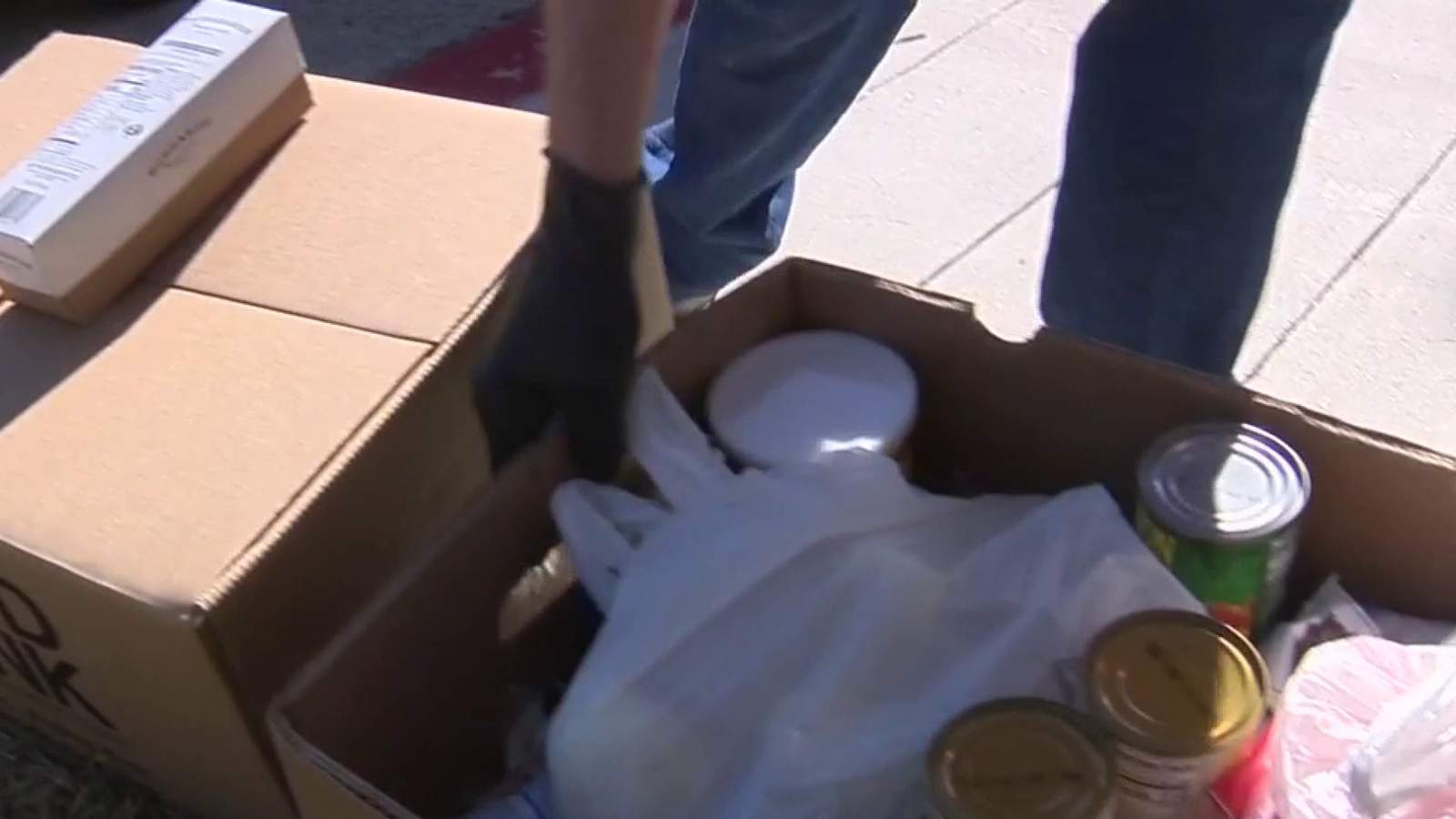 Volunteers for Project Hope distribute food at Episcopal Church of the Holy Spirit