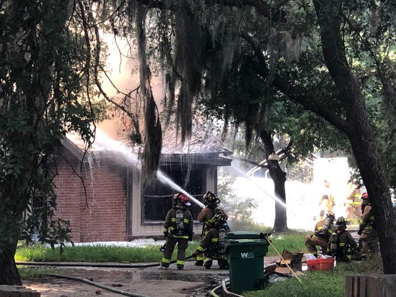 House fire on North Side under control, damages extensive, firefighters say