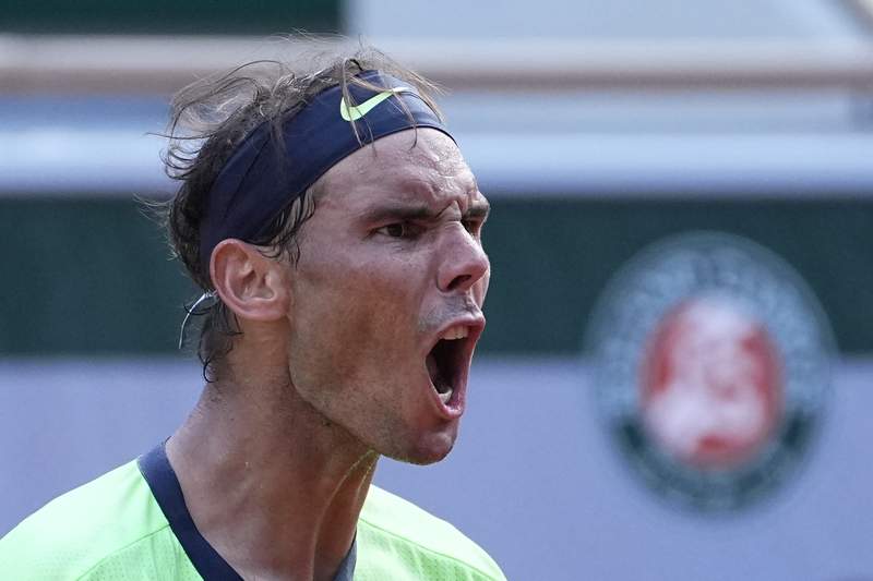 The Latest: Nadal drops set but moves into French Open SF