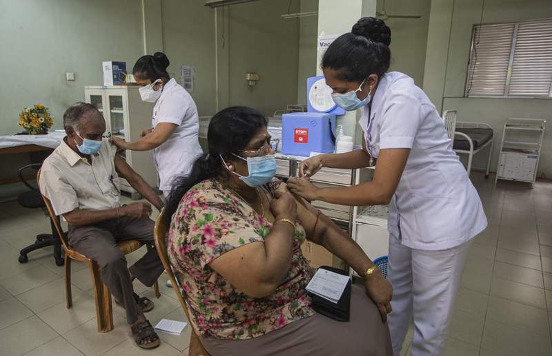 Virus surge, vaccine shortages spread beyond India's borders