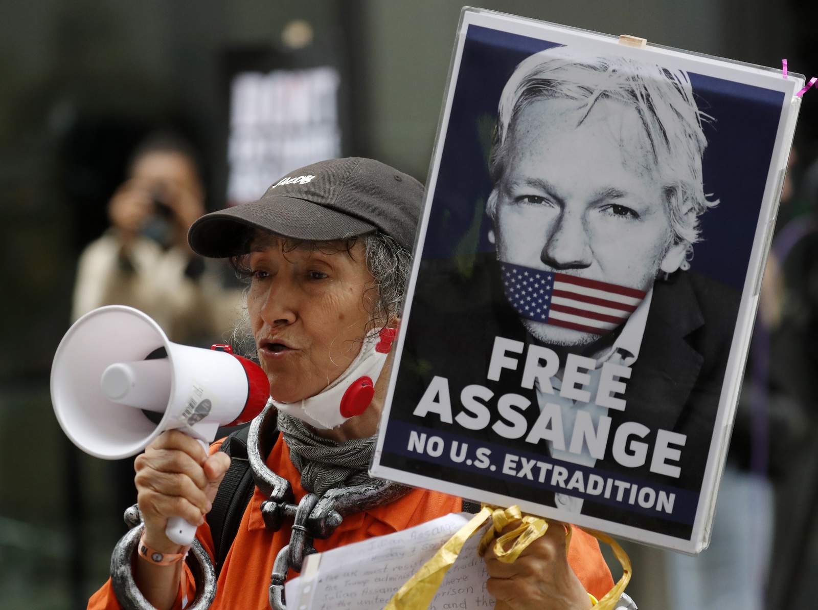 Assange extradition hearing paused over COVID-19 risk