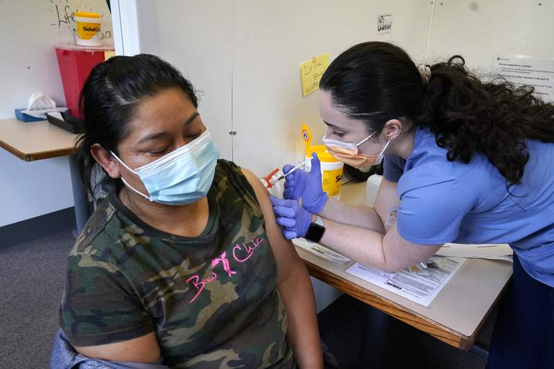 The Latest: Washington offers prizes for getting vaccinated