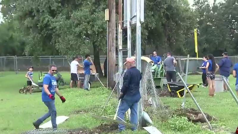 Volunteers pitch in to help clean up Northwest Little League baseball field