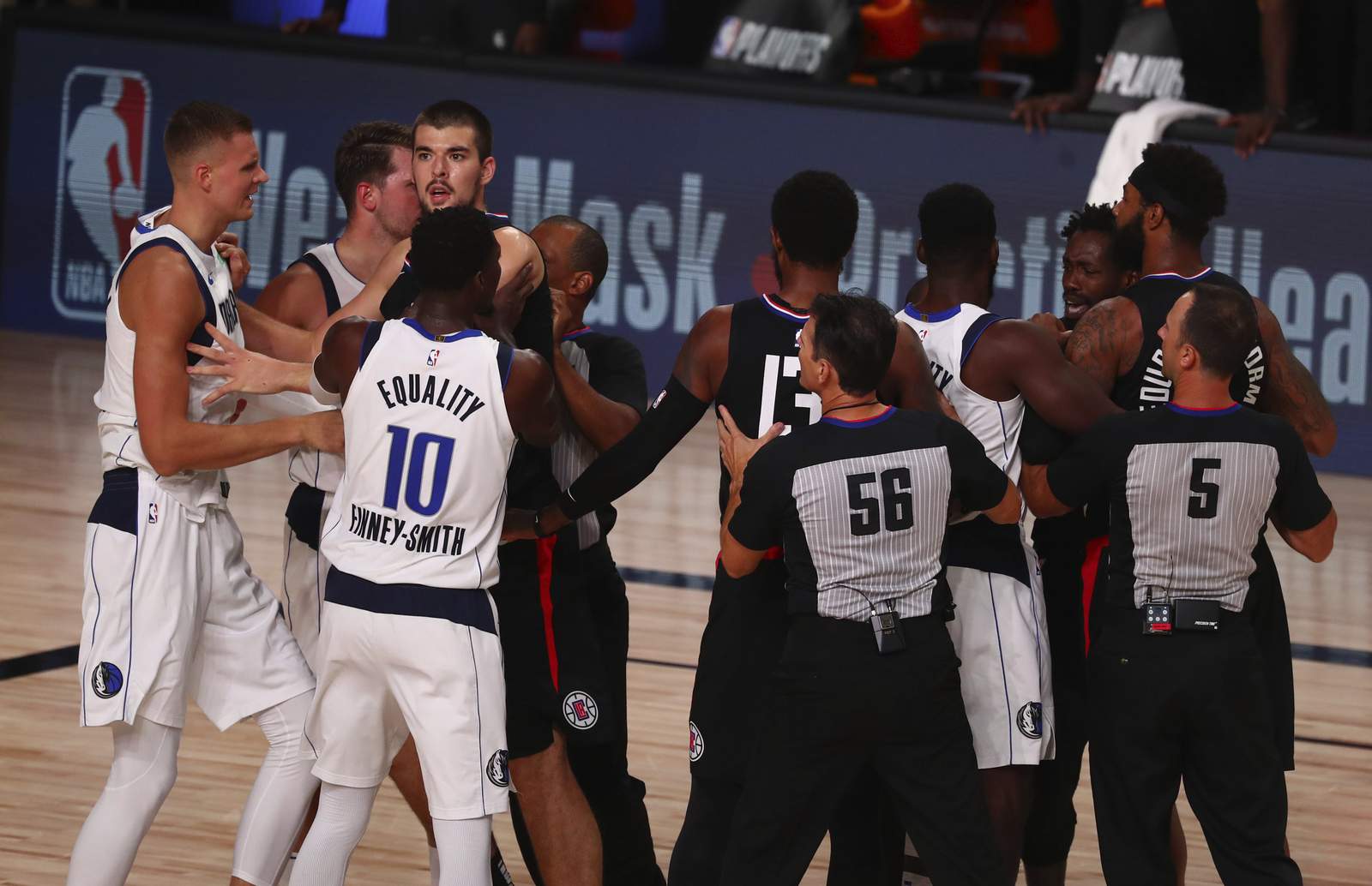 Clippers hold off Doncic, Mavs after Porzingis is tossed