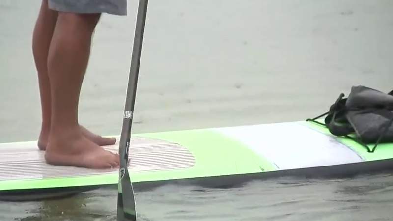 Soak up the sun and fun at Boerne Lake on a paddle board