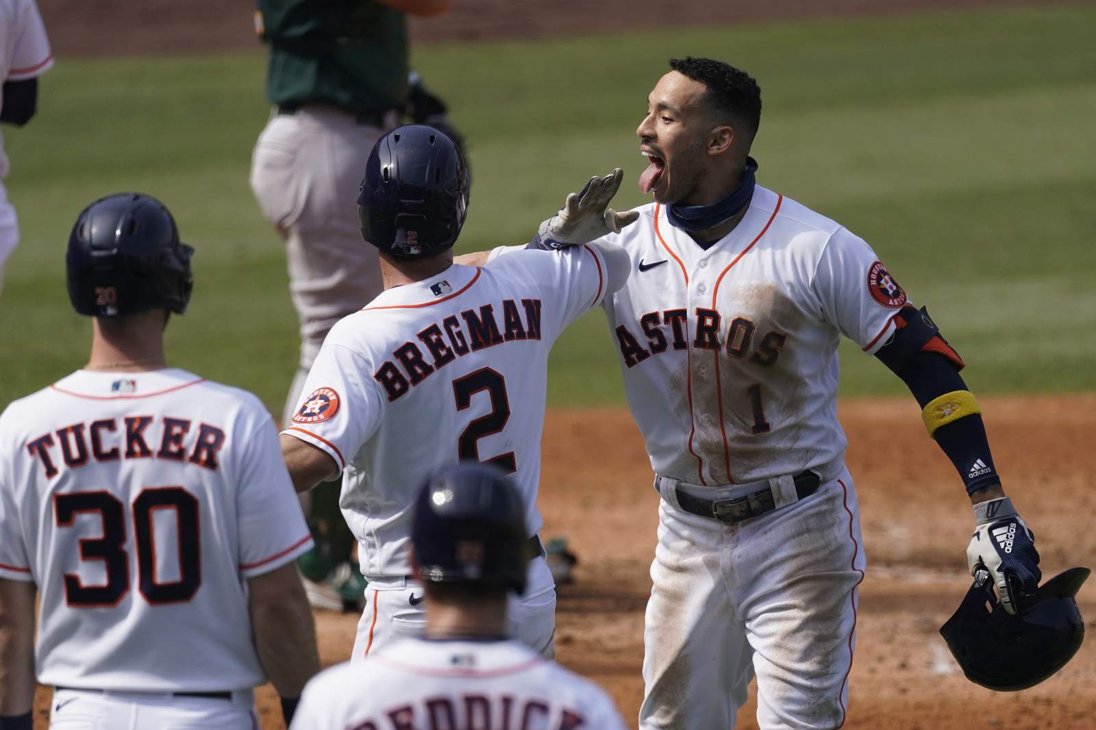 Correa powers Astros past A's 11-6 to clinch ALDS