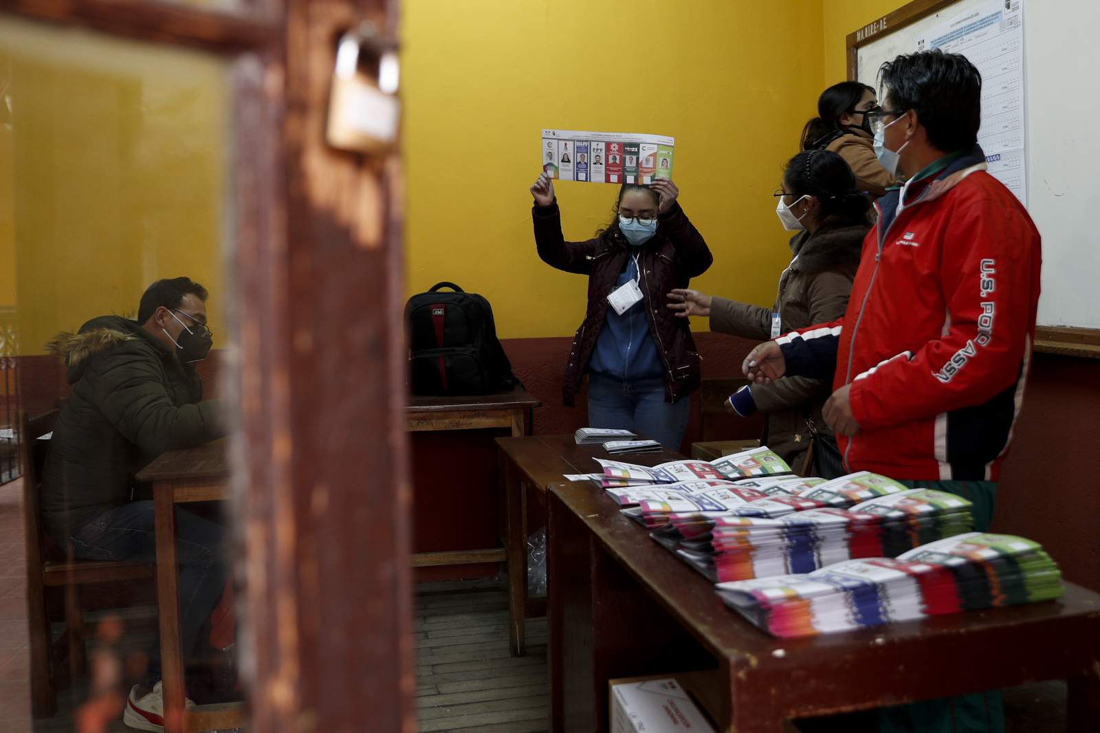 A tense Bolivia awaits voting results in redo amid pandemic