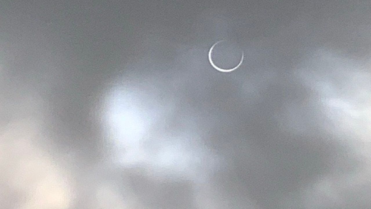 The October 2023 Annular Eclipse visible through cloudy skies in Port Aransas, Texas.