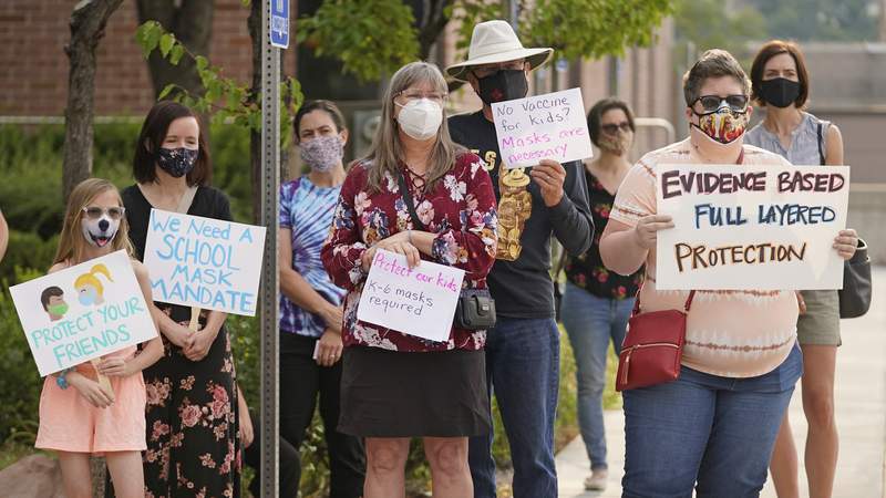 Schools fight back against GOP governors, defy bans on masks