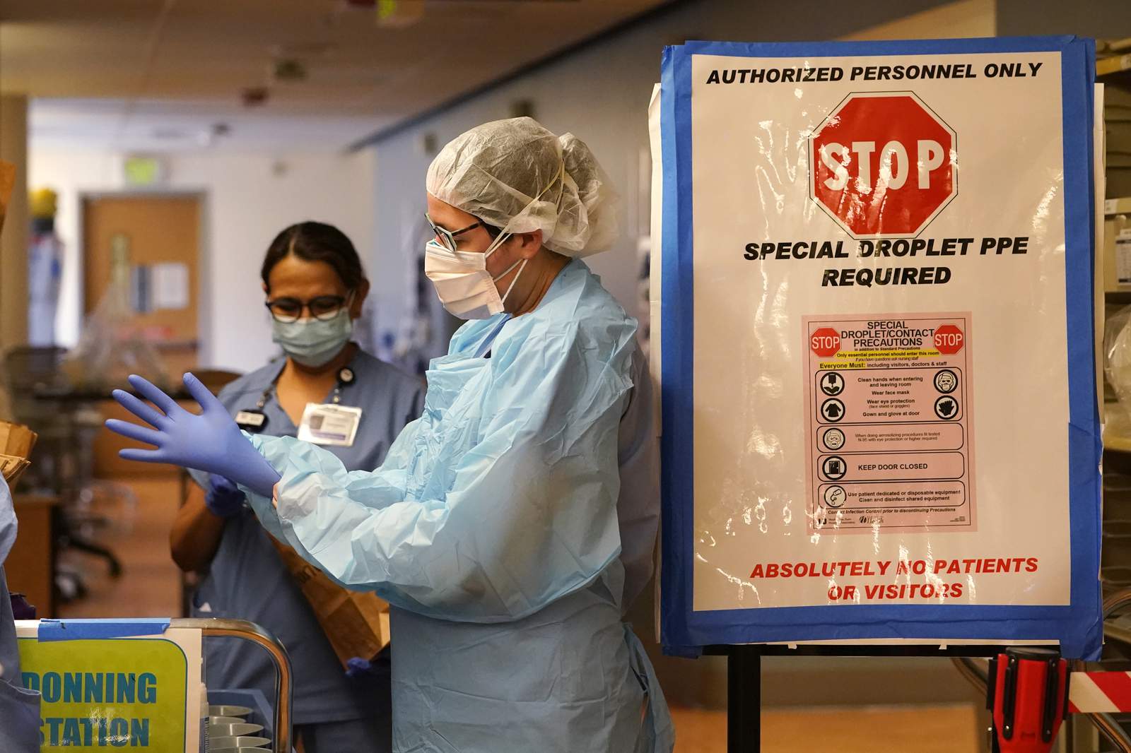 Pandemic’s deadliest month in US ends with signs of progress