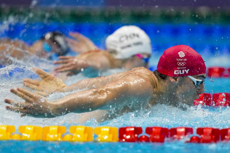 In Olympic first, men, women swim together in wild medley