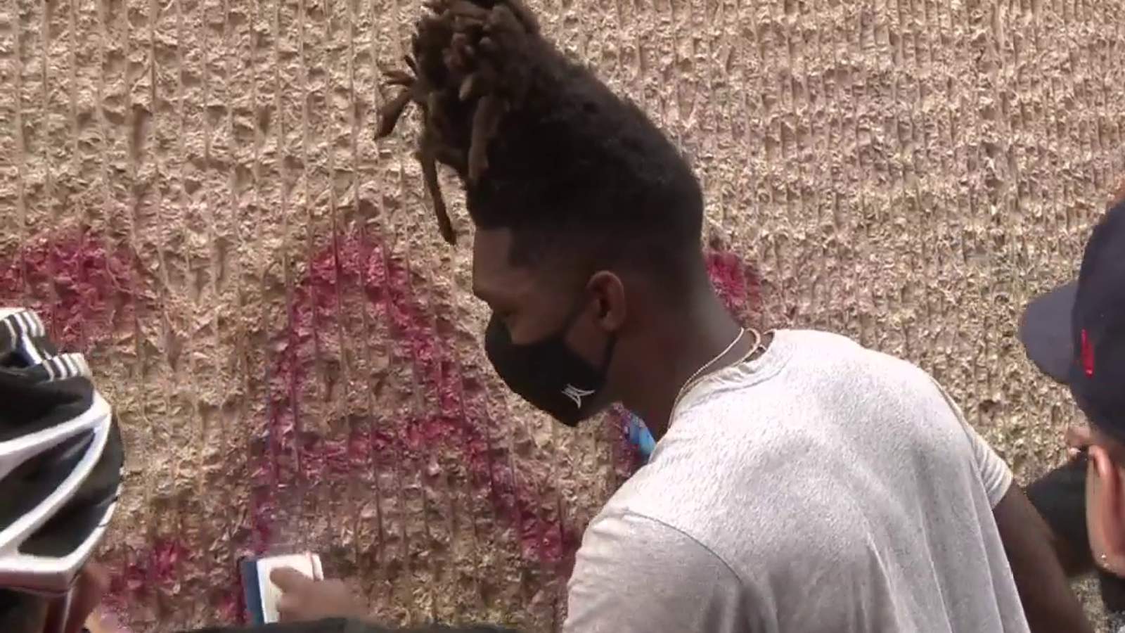 Spurs Lonnie Walker passes out water, joins community cleanup after businesses damaged in downtown San Antonio