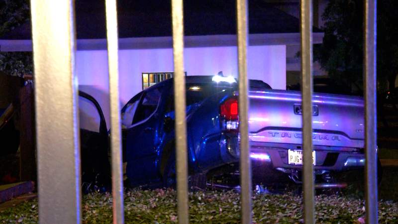 Driver crashes into vehicle, fence at North Side apartment complex, police say