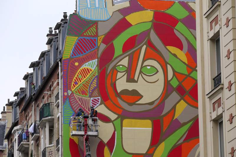 American, French artists revive hope on giant Paris mural