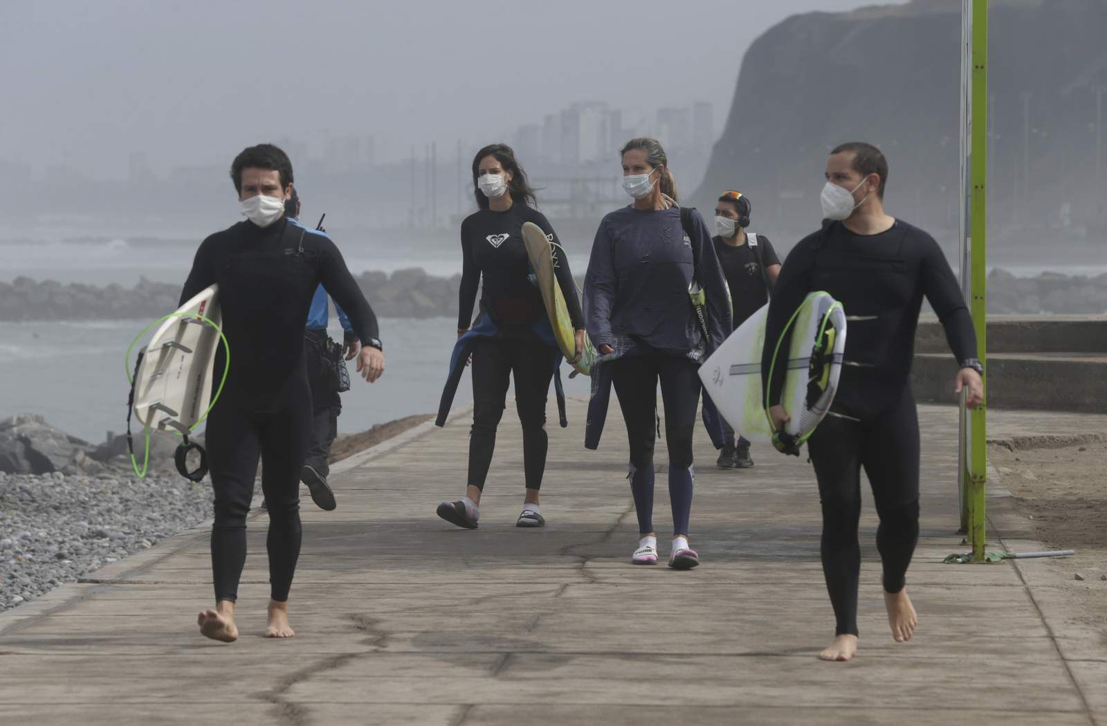 Quarantined surfers return to Peru's famous waves