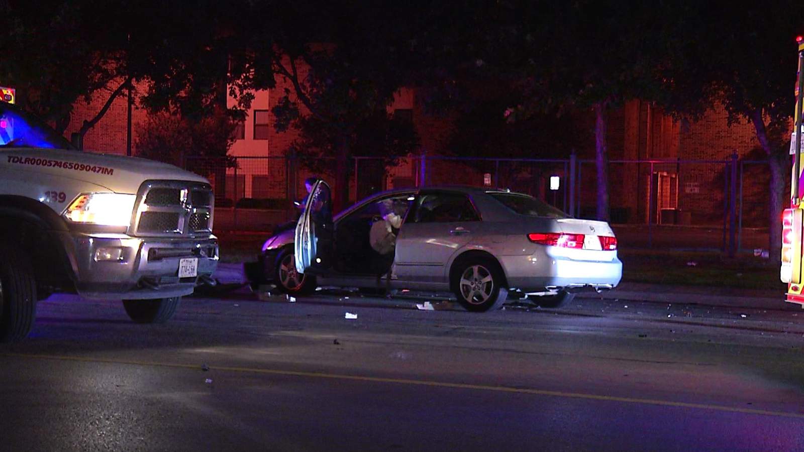 Late-night crash sends vehicle through fence, police say