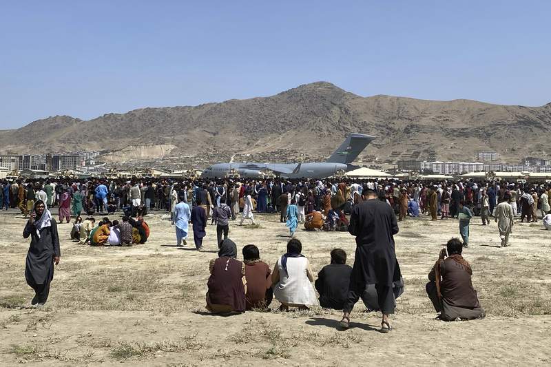 The Latest: Australia flies out 26 from Kabul, plans more