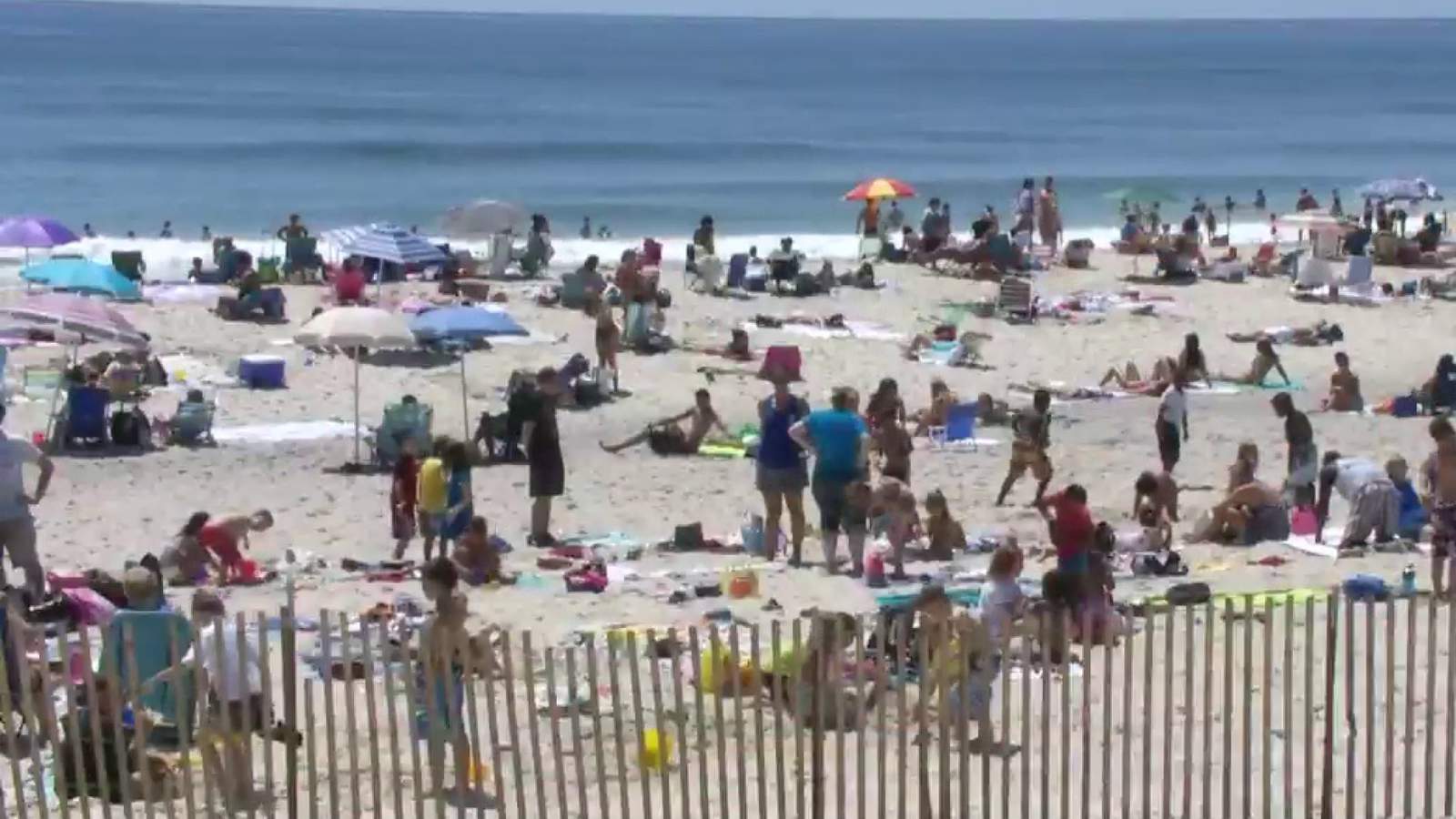 Beachgoers face sand, surf, social distancing