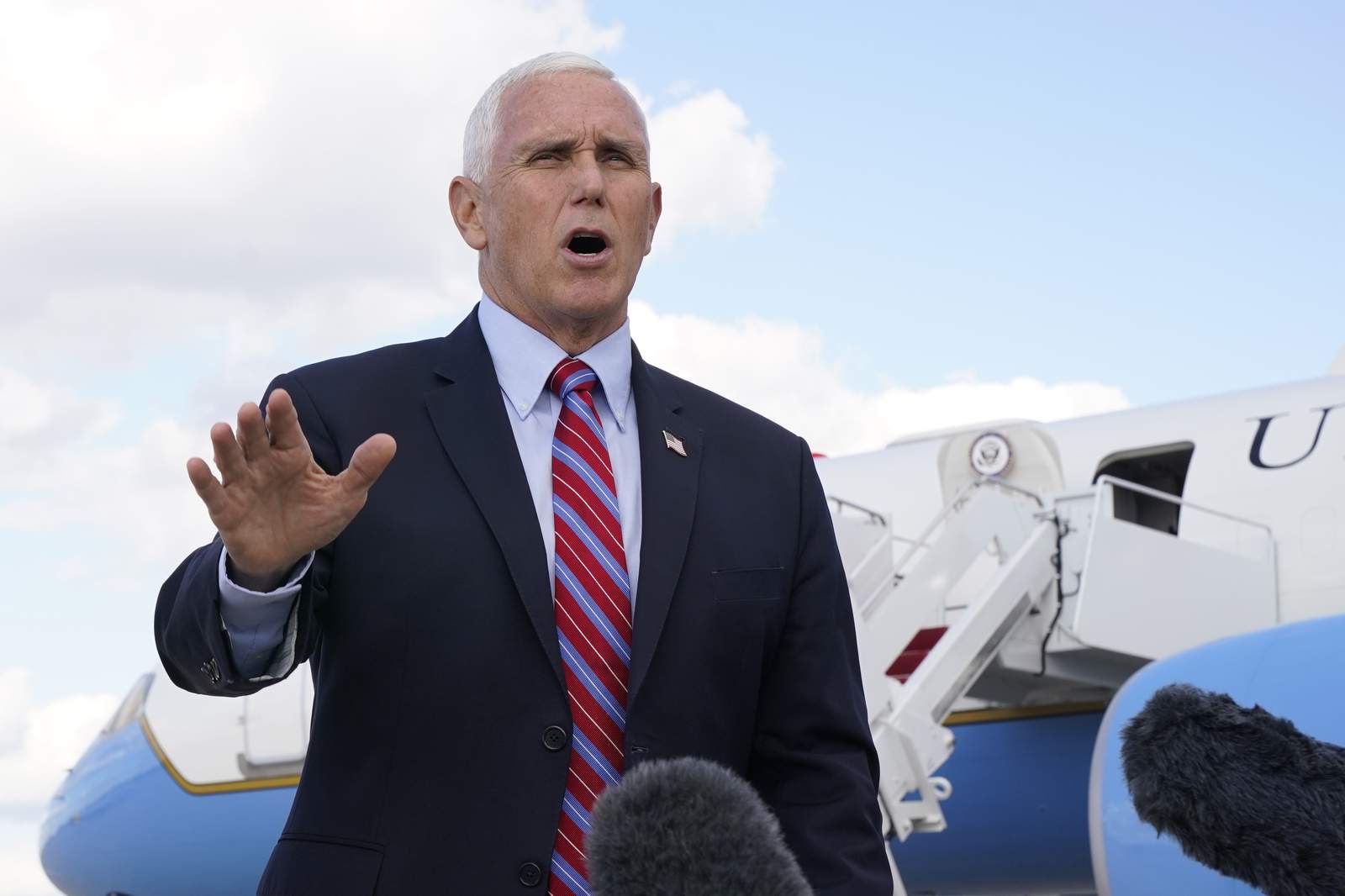 Pence takes lead role in campaign with Trump travel stopped