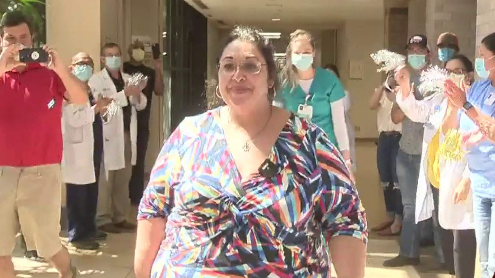 Discharged ‘miracle’ patient greeted by cheers, applause